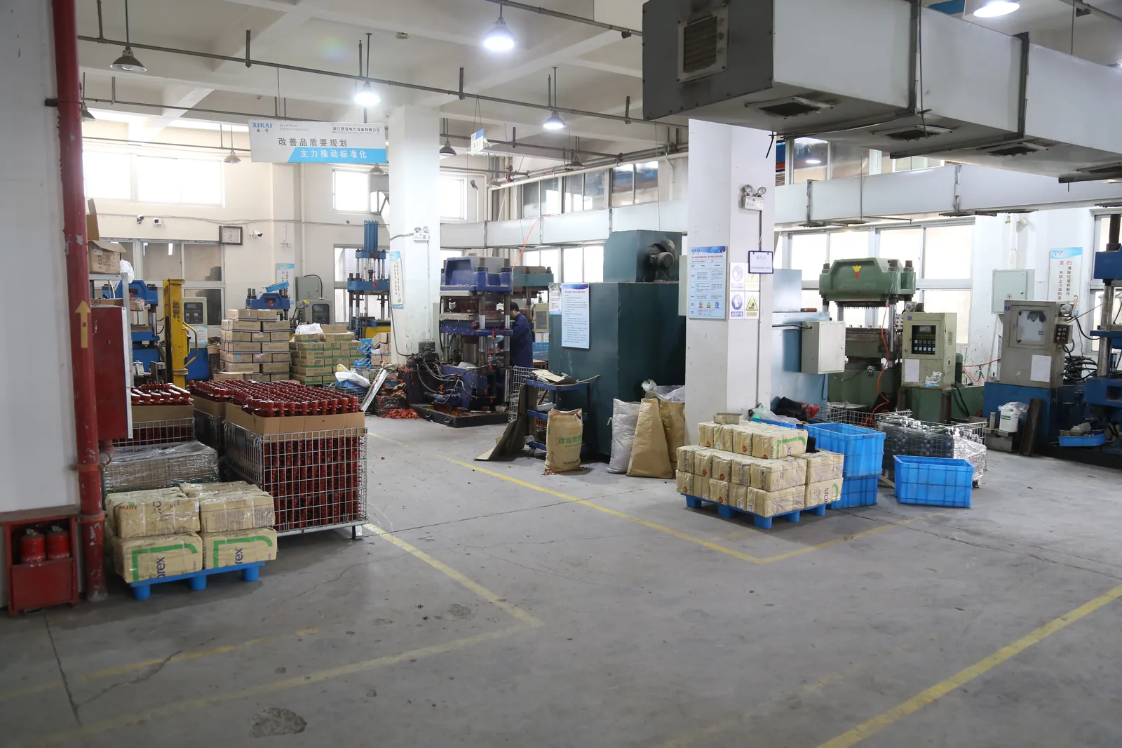 Xiya Electric production area with packed materials and workshop equipment