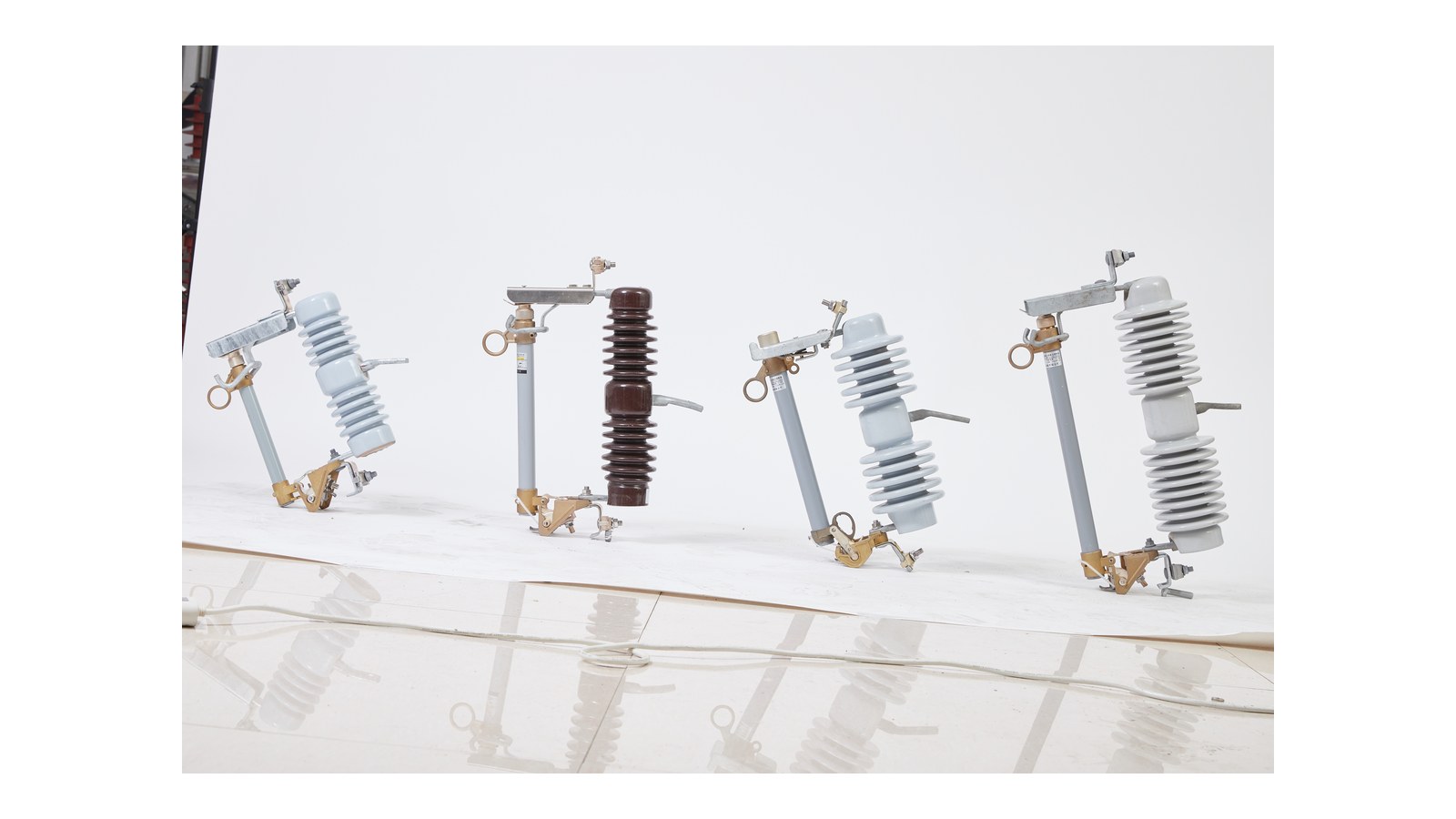 Porcelain drop out fuse cutout product group on clean white background