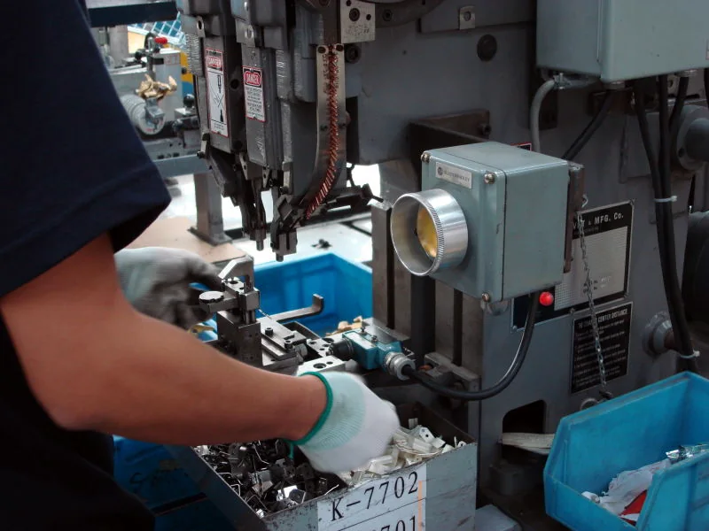 Operator machining a customized electrical equipment component