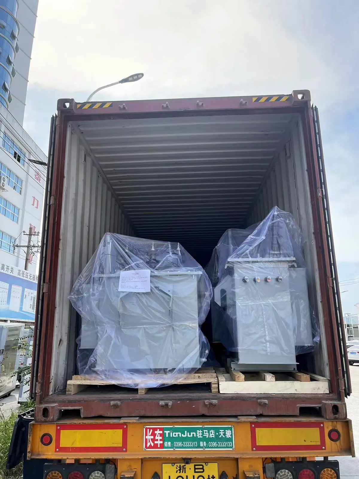 Export crates loaded into a shipping container for electrical equipment delivery